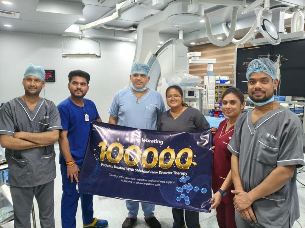 Dr. Nishant Kumar Shukla receiving Certificate of Gratitude for 100,000 Medtronic Parkinson's Therapy milestones